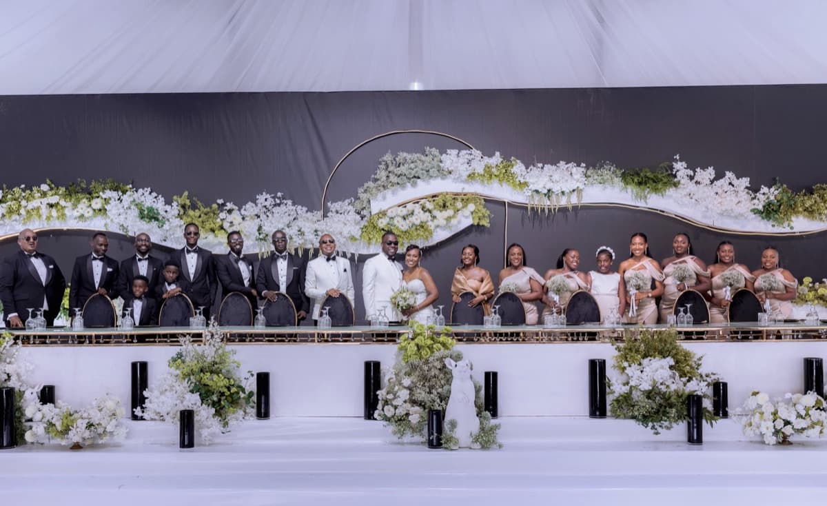 Oscar & Sandra's grand reception with black & white decor, gold arches and white floral installations