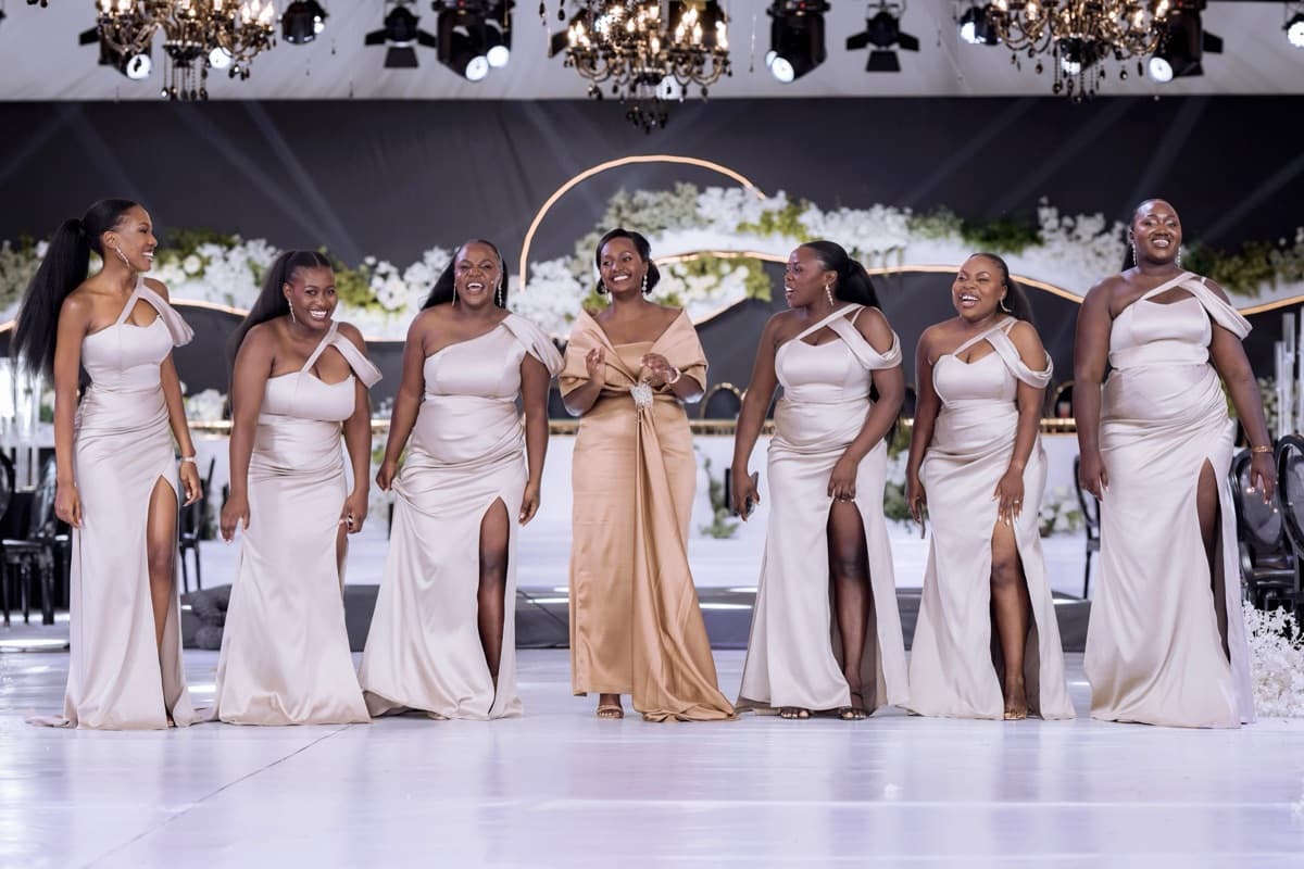 Bridal party in champagne gowns at a luxury reception styled by Modern Charm